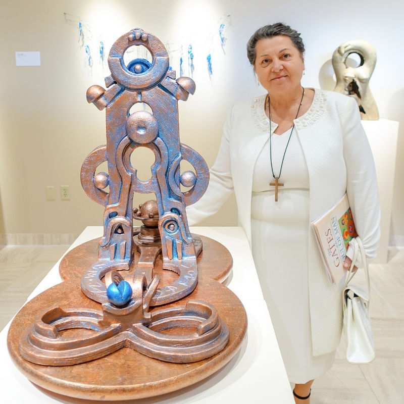 Anne Furnaris photographed with her sculpture "The Gates of the Sun I"